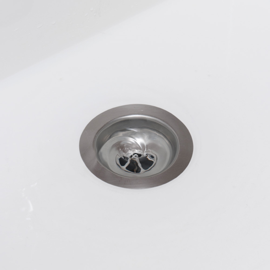 Stainless steel sink drain on a white background