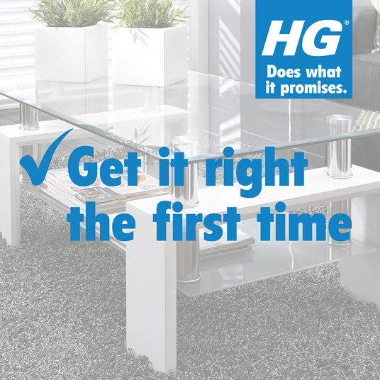 Modern office interior with glass partitions and plants, featuring HG logo and slogan.