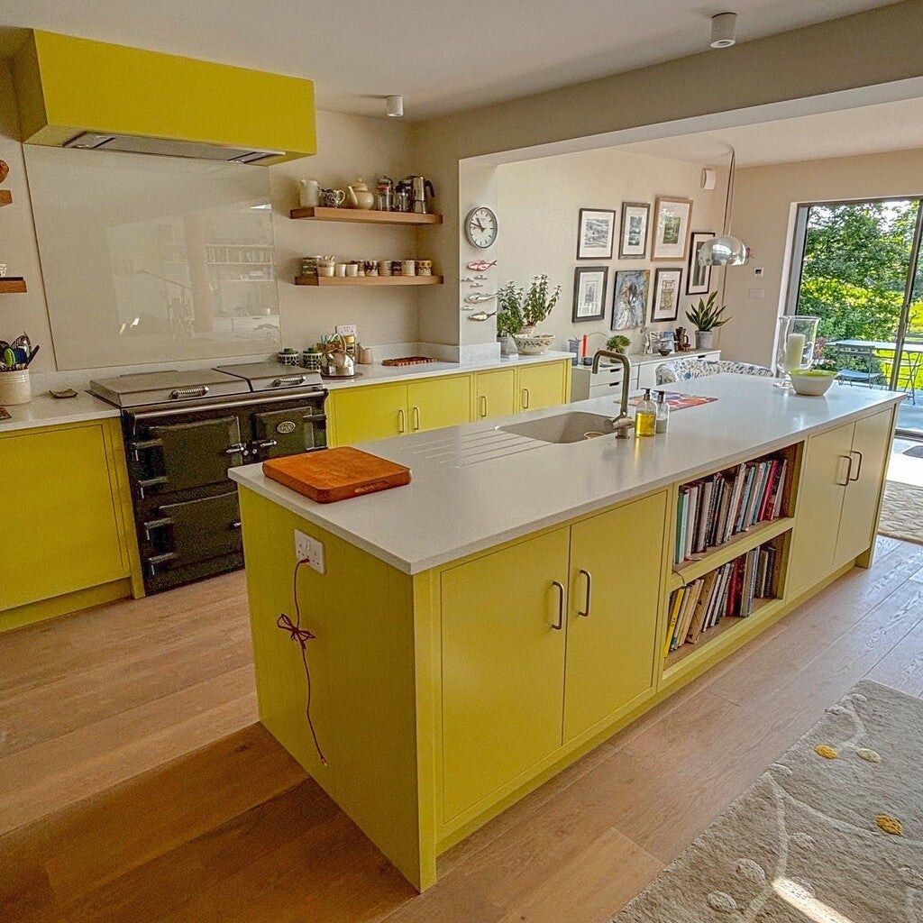 Modern kitchen with yellow cabinets and white countertops