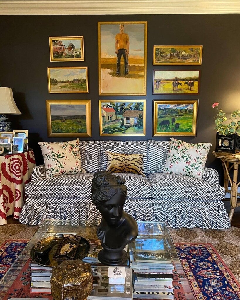 Living room with gray sofa, decorative pillows, and wall art.