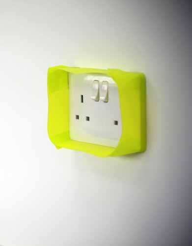 Wall socket cover with LED light on a white background with green tape around the edges