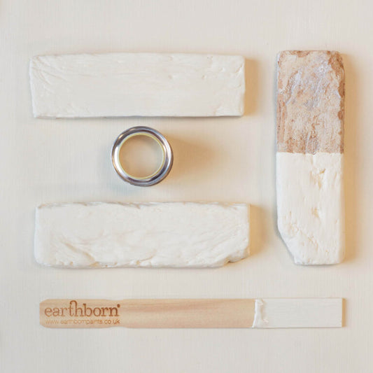 Collection of natural products with 'earthborn' branding on a light background