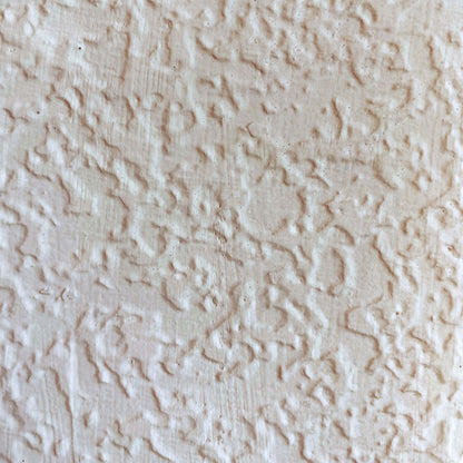 Textured beige wallpaper pattern