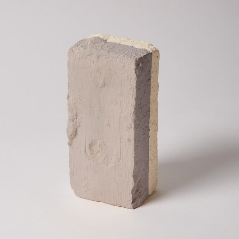 Concrete block with a gray interior on a white background