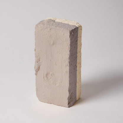 Concrete block with a gray interior on a white background