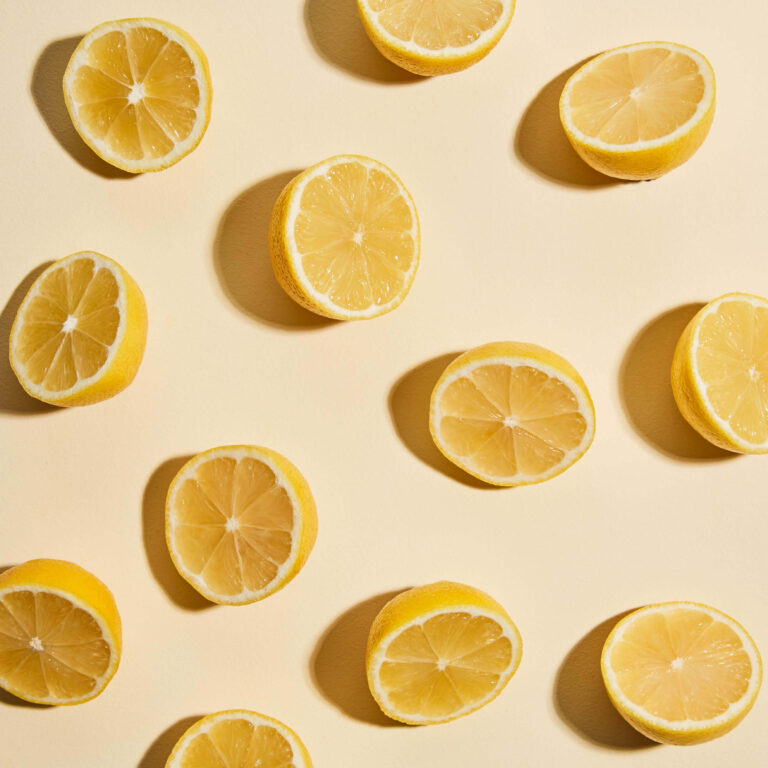 Pattern of sliced lemons on a beige background