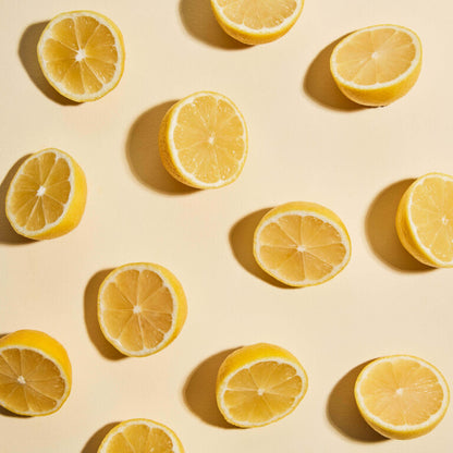 Pattern of sliced lemons on a beige background