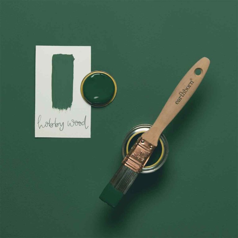 Green paint with a brush and color swatch on a green background