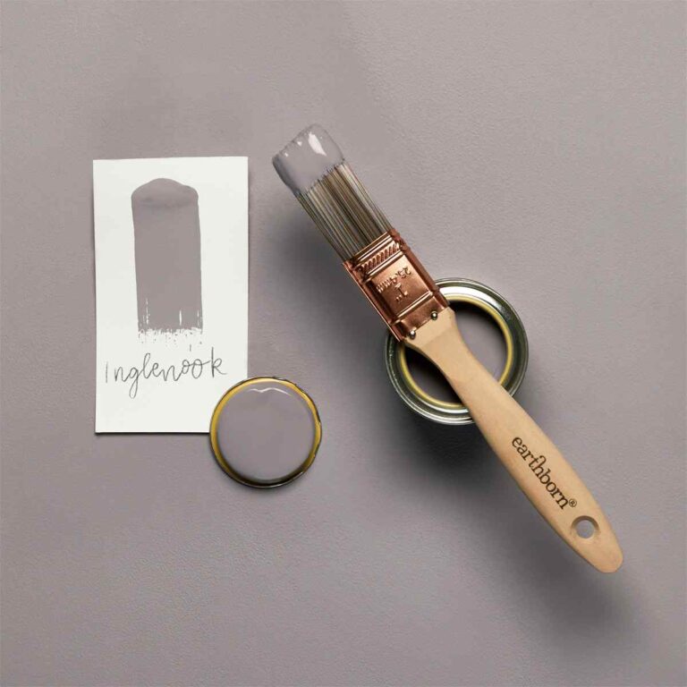 Paintbrush and paint can with color swatch on a gray background