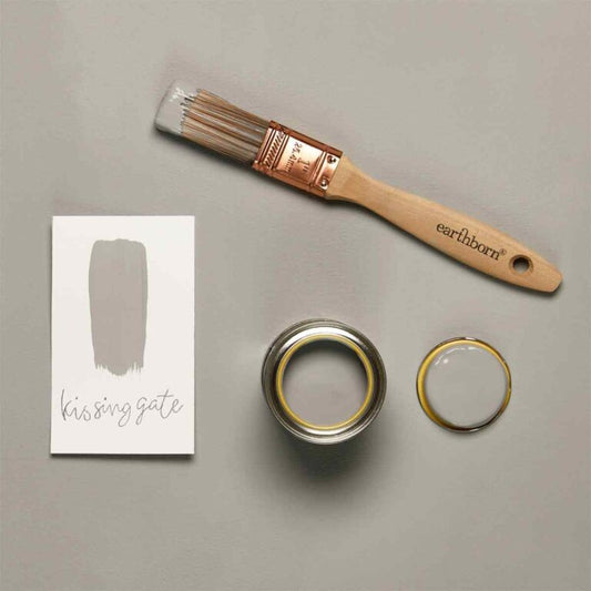 Paint brush, paint can, and color swatch labeled 'kissing gate' on a gray background