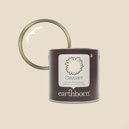 Earthborn clay paint can with a lid on a beige background