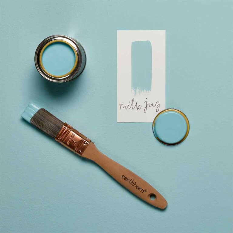 Paint can, brush, and color swatch on a light blue background