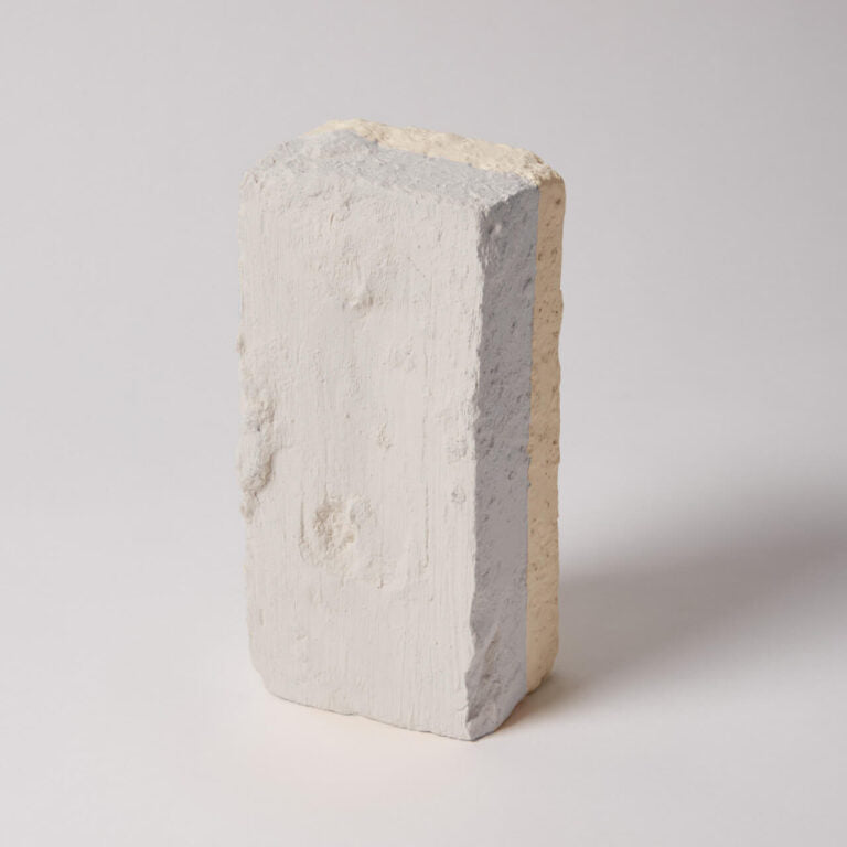 Concrete block with a gray and beige interior on a white background