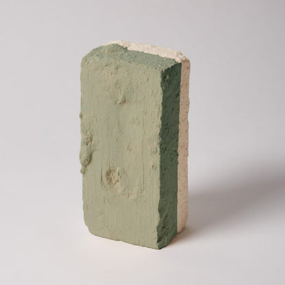 Green and beige brick on a white background