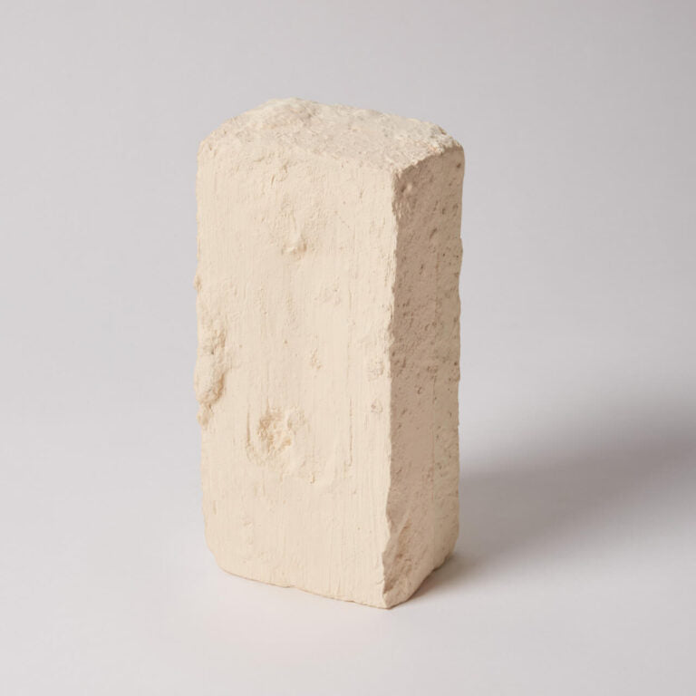 Beige ceramic brick on a light gray background