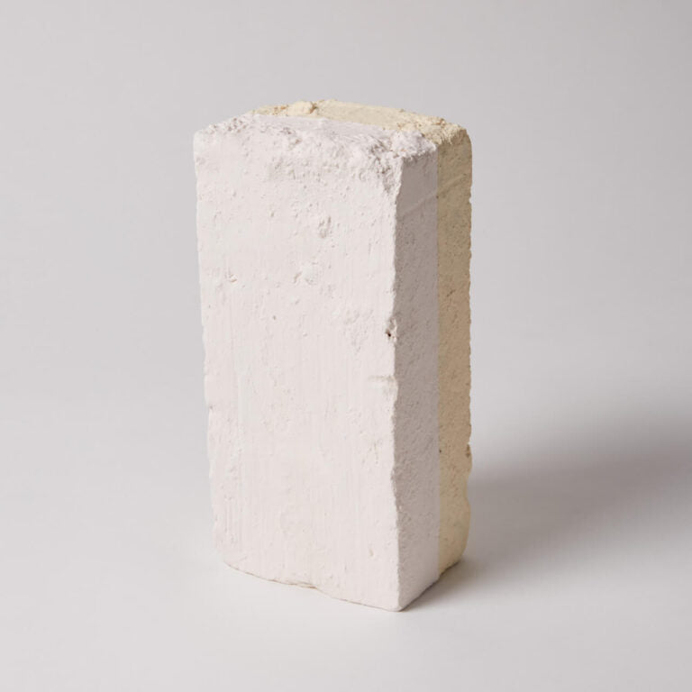 Paint being shown on a brick.