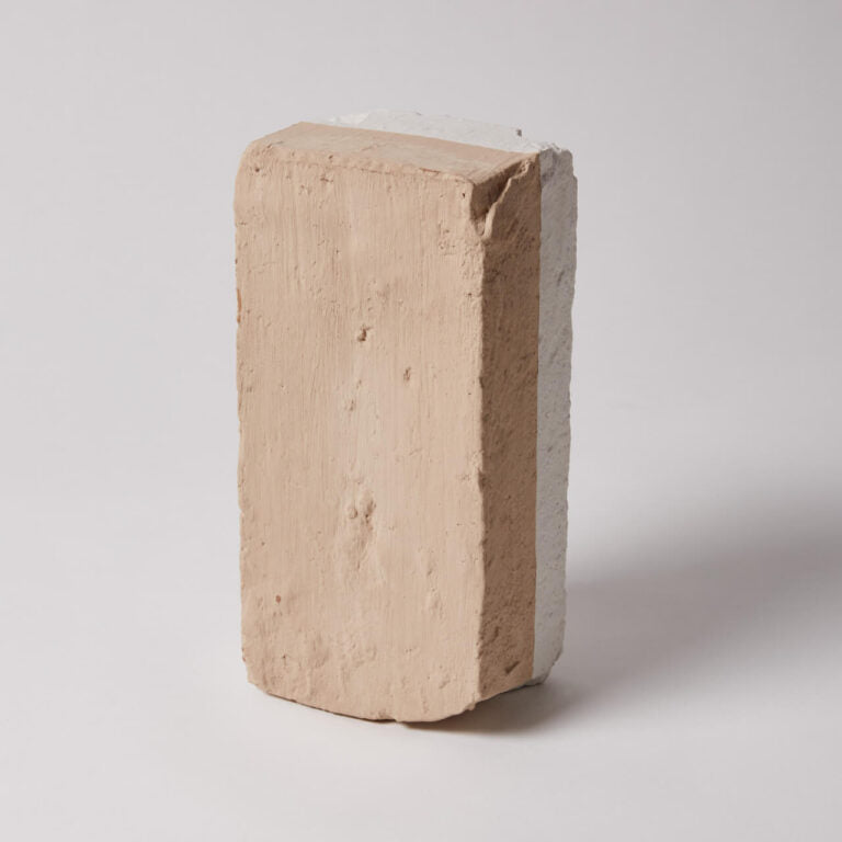 Beige brick on a white background