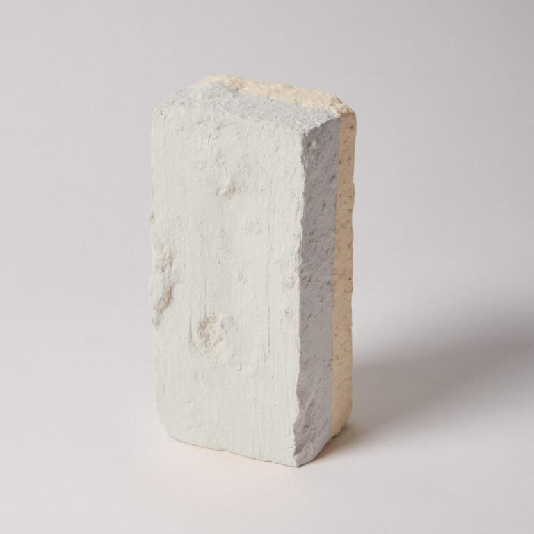 Concrete block with a gradient of colors on a white background
