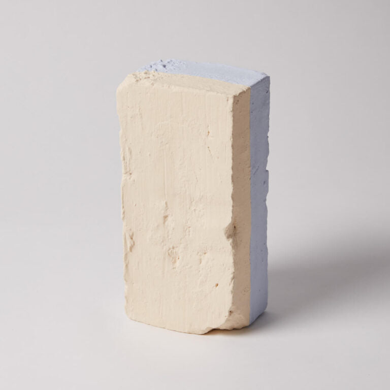 Rectangular block of cream-colored material on a light gray background