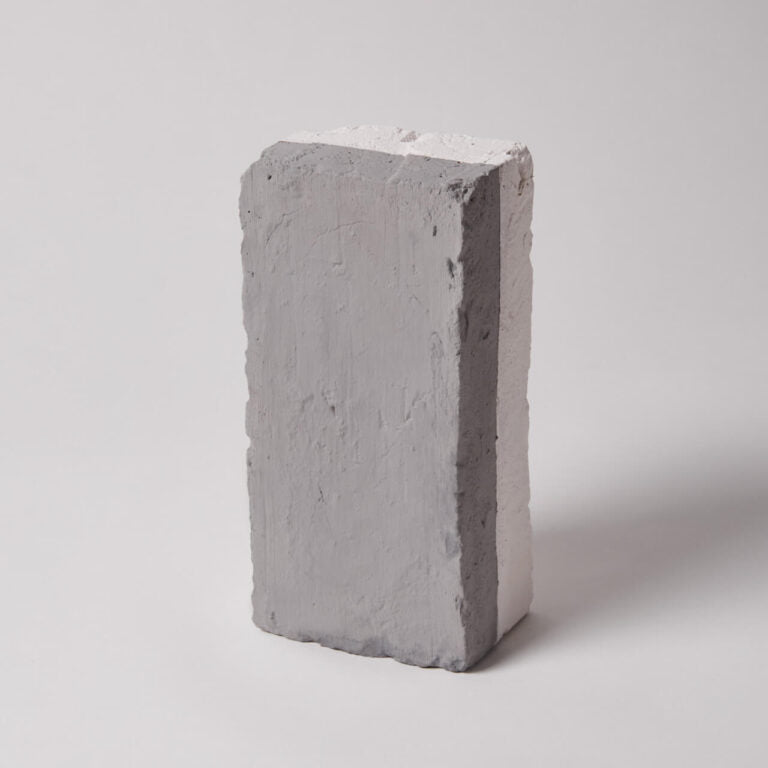 Gray concrete block on a white background