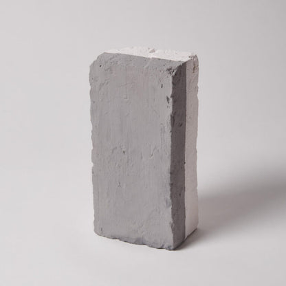 Gray concrete block on a white background