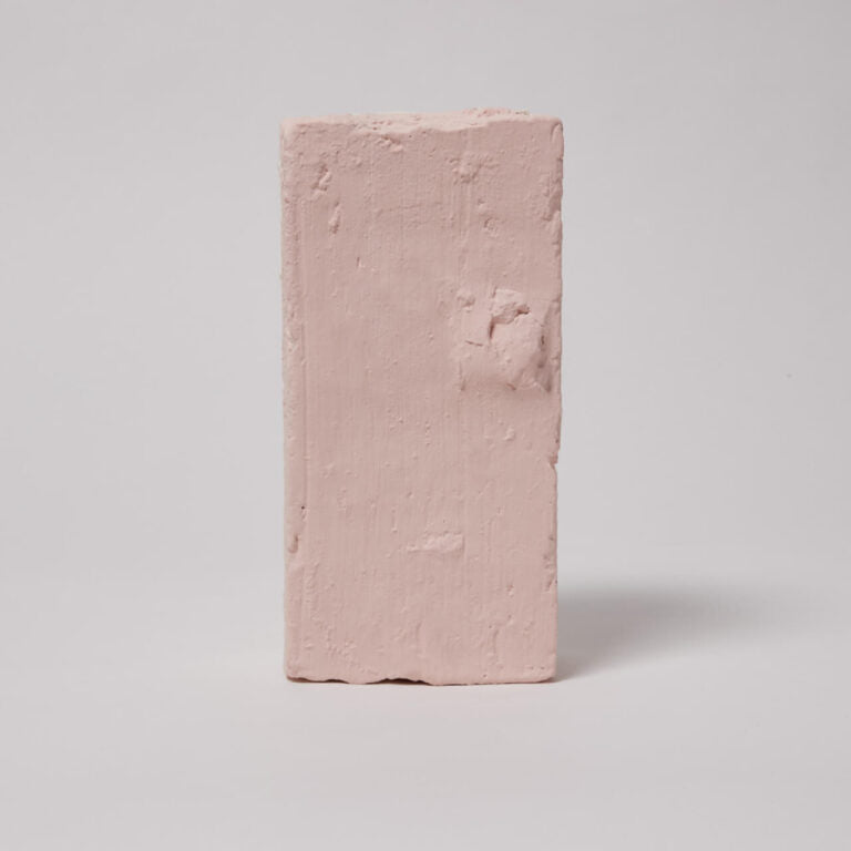 Pink brick on a light gray background