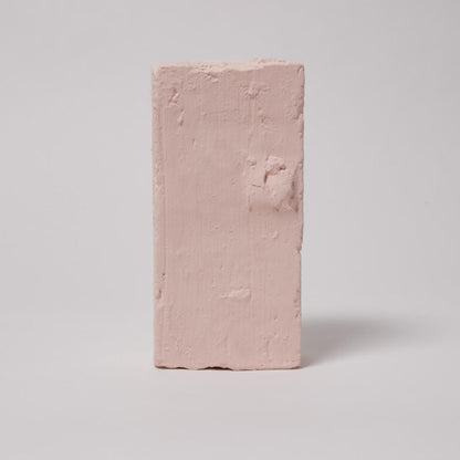 Pink brick on a light gray background
