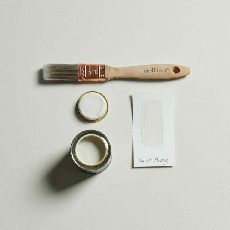 Paintbrush, paint can, and packaging on a light gray background