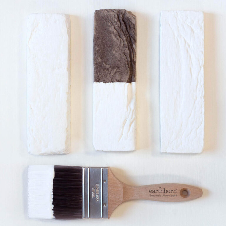 Three textured paint samples with a brush labeled 'earthborn' on a white background