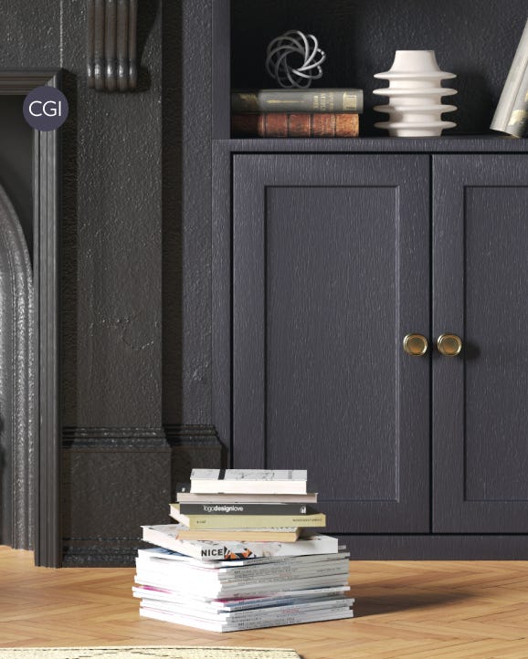 Stack of books on a wooden surface with a dark gray cabinet in the background