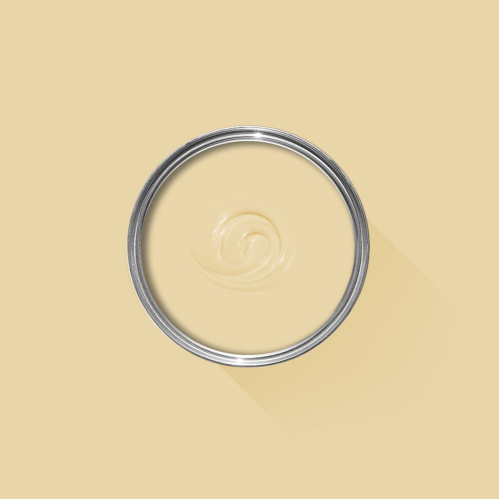 Metallic ring with a central swirl design on a beige background