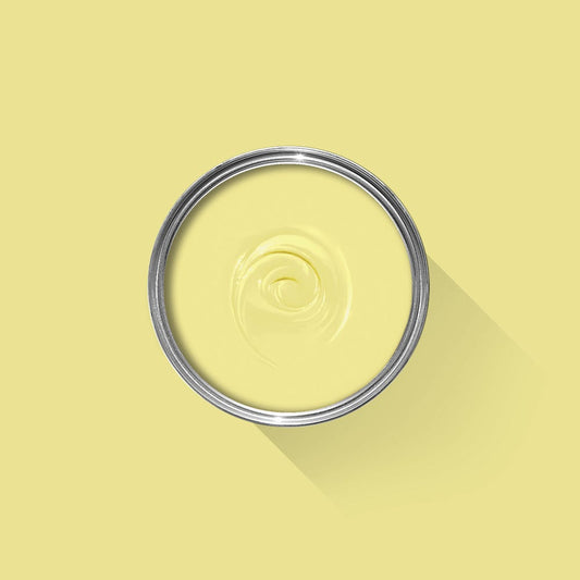 Yellow paint with a silver lid on a yellow background