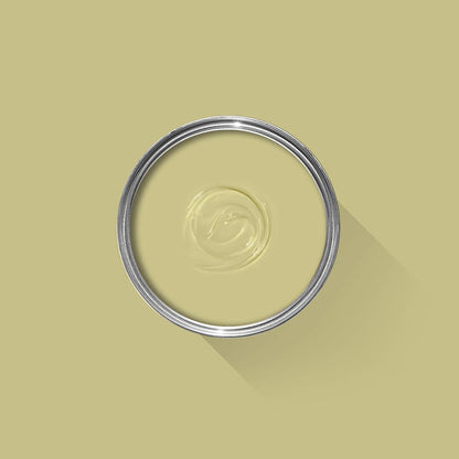 Clear liquid in a metallic ring on a beige background