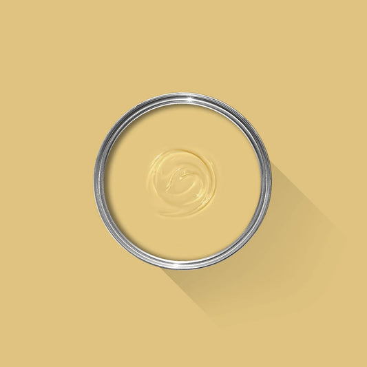 Metallic ring with a central design on a yellow background