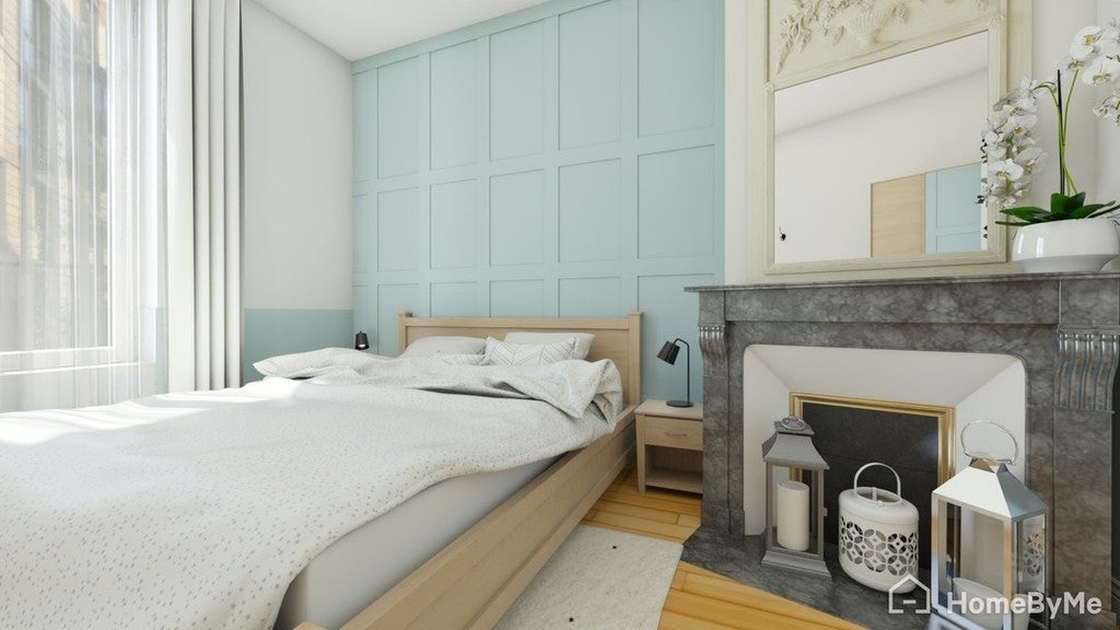 Modern bedroom with light blue wall, bed, nightstands, and fireplace.