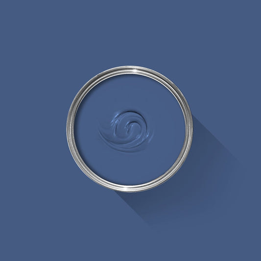 Blue paint swatch with a silver lid on a blue background
