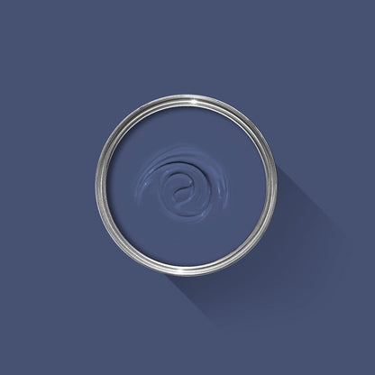 Metallic ring with a central swirl design on a dark blue background