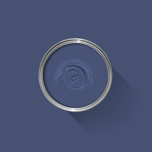 Metallic ring with a central swirl design on a dark blue background