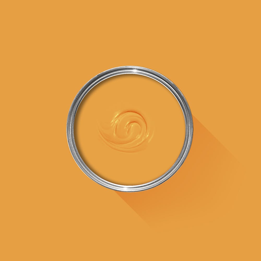 Metallic ring with a swirled design on an orange background