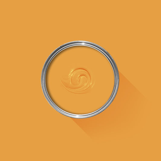 Metallic ring with a swirled design on an orange background