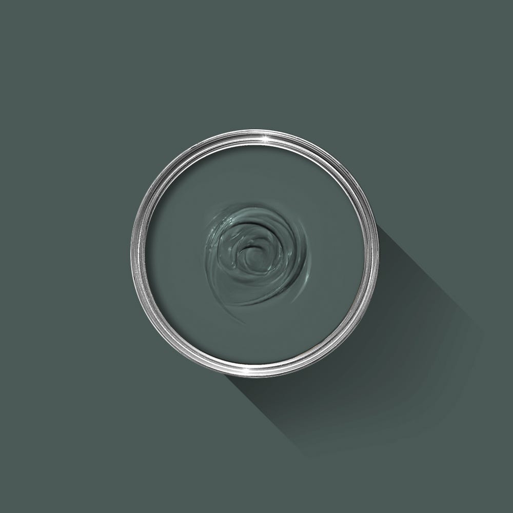 Clear glass bowl with a spiral design on a dark green background