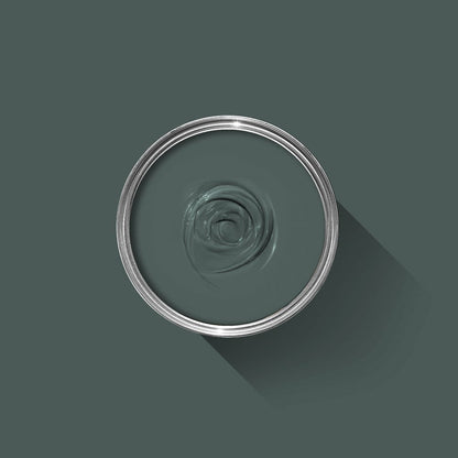 Clear glass bowl with a spiral design on a dark green background