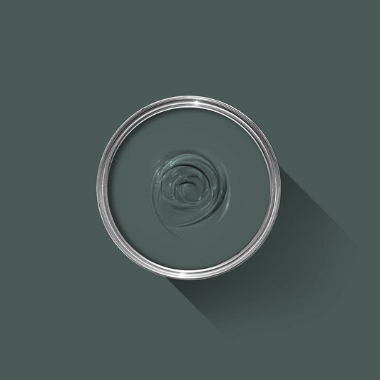 Clear glass bowl with a spiral design on a dark green background