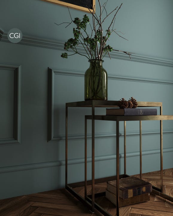 Decorative setup with a vase of flowers on a table against a teal wall.