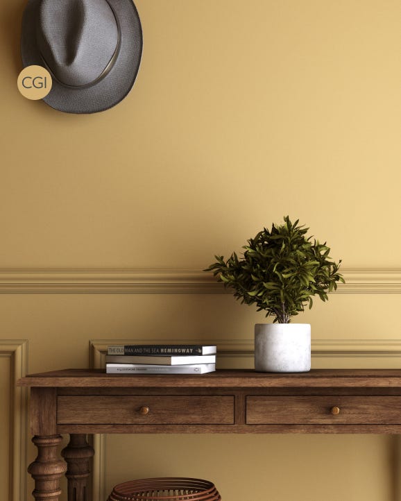 Wooden console table with a plant and books against a mustard yellow wall.