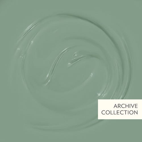Close-up of a swatch of green paint with 'Archive Collection' label.