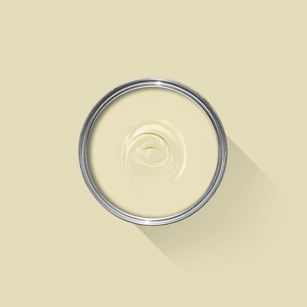 Close-up of a container with a swirl of cream on a beige background