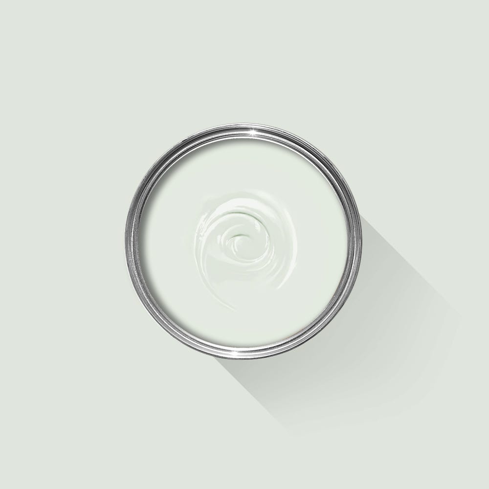 Clear glass lid with a metal rim on a light gray background