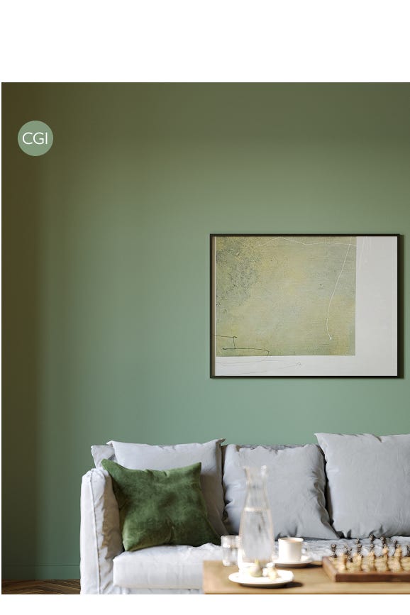 Living room with a green wall, gray sofa, and framed artwork.