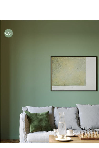 Living room with a green wall, gray sofa, and framed artwork.